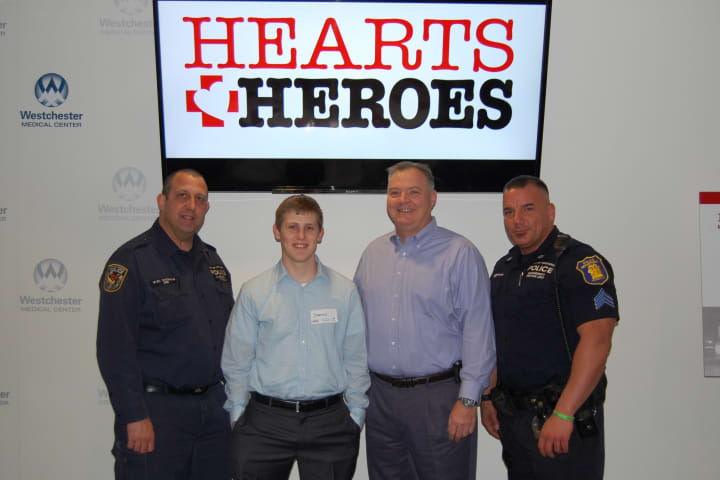 Yonkers resident James Murphy, second from left, meets with the first responders who saved his life on Easter 2013.