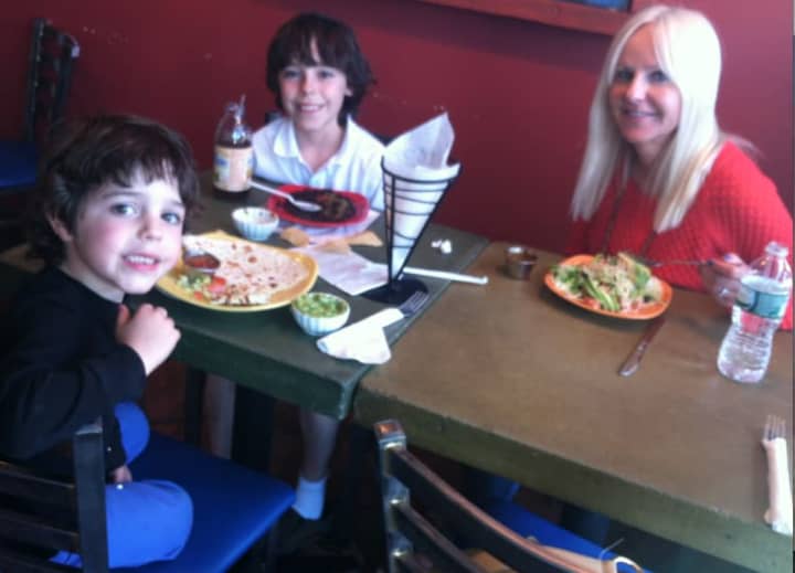 Dawn Konzerowsky enjoys a Mexican meal with her sons, Jack, 5, at left, and Max, 10, center, at Olé Molé at 1030 High Ridge Road on Cinco de Mayo. A former Texas resident she praised the restaurant as having authentic Mexican food.