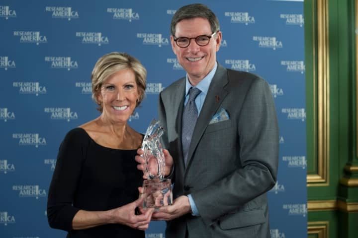 Norwalk Multiple Myeloma Research Foundation Founder and CEO Kathy Giusti recently received two national awards. Giusti is pictured receiving Research!America&#x27;s Leadership Award from William N. Hait, a Research!America Board member.