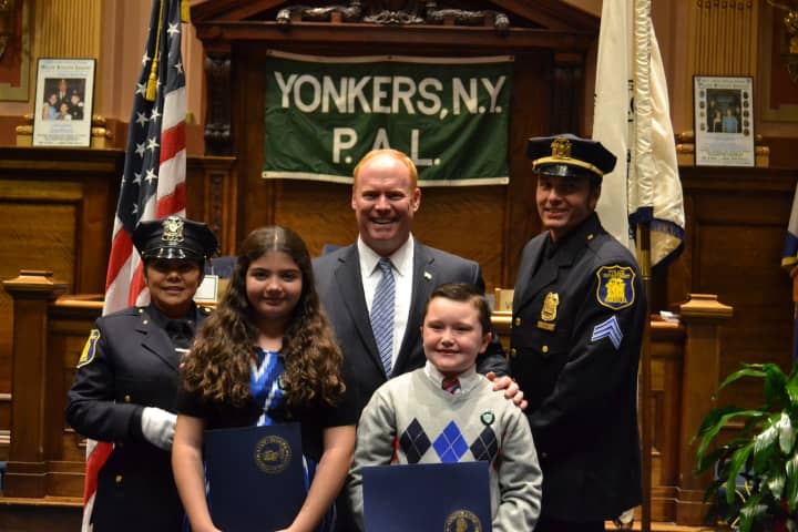 Pictured, from left, are Yonkers Police Officer of the Year Officer Jacquelyn Estevez, Christina Ljuljic, Council President Liam J. McLaughlin, Colin Nowak and Officer of the Year Sergeant Patrick York.