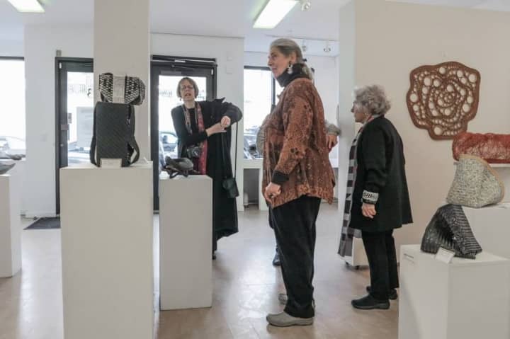 Guests enjoy an exhibit at Blue Door Art Center in Yonkers.