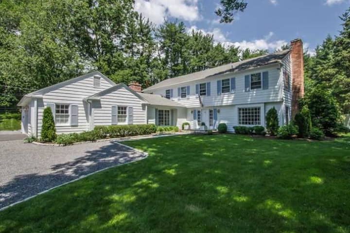 The home at 4 Parsons Walk in Darien offers close-to-town privacy. 