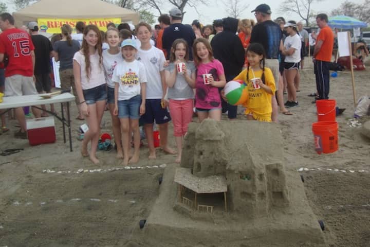The winners of the Most Creative award at Homes with Hope&#x27;s Castles in the Sand fundraiser at Compo Beach in Westport.