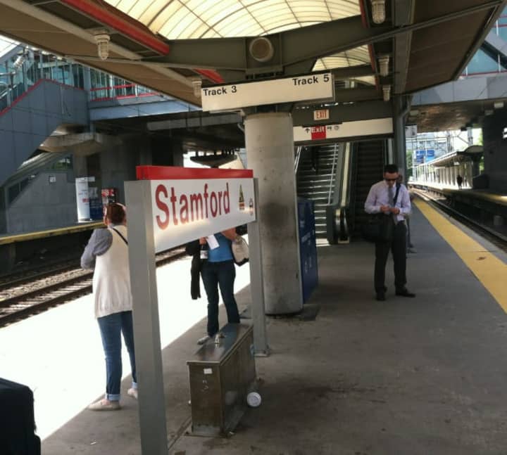 Commuters wait for the 11:25 a.m. train to Grand Central Terminal on Monday in Stamford. A fire Saturday in Cos Cob damaged an important switching station, Metro-North officials said.