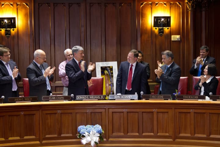 Fairfield Sen. John McKinney is applauded by state legislators during a ceremony honoring McKinney for his 16 years of service in the Connecticut General Assembly.