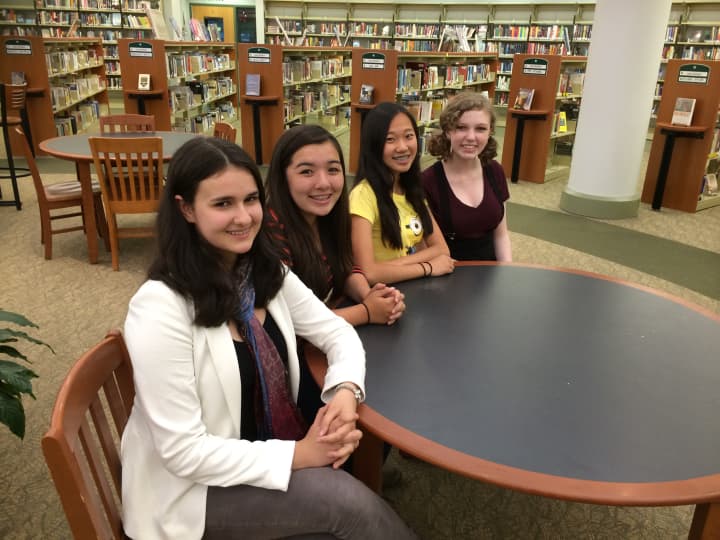 Westport teens Claire Dinshaw, Erika MacDonald, Natalie Chun and Zia Sansted work together to host a &#x27;passion-themed&#x27; TEDx talk in the Staples High School Auditorium in Westport. 