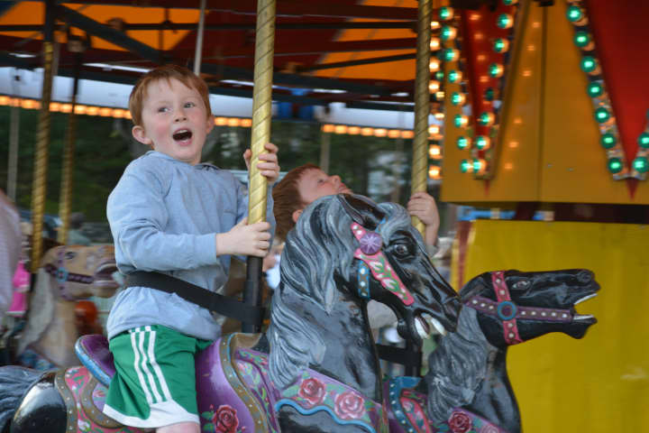 6-year-old Patrick Calabro, a Darien, Conn., resident, on a carousel at the carnival.