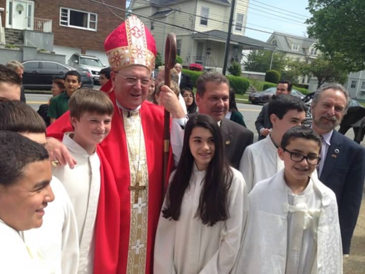 Cardinal Dolan meets with altar servers to celebrate a Eucharistic liturgy at Sacred Heart Church.