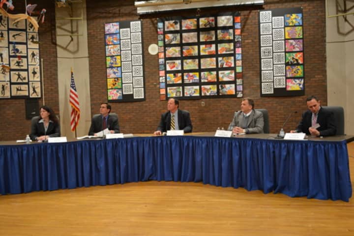 Andrew Bracco, second from left, Eric Karle, center, and Edward Reder, right, won Bedford school board seats. The candidates are pictured at a recent forum.