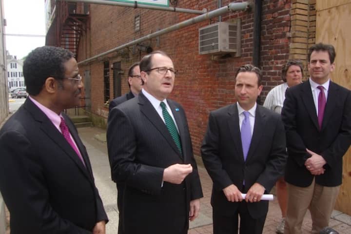 Representatives from Connecticut Light &amp; Power, the state legislature and the Wall Street Theater announce new funding for the historic Norwalk theater&#x27;s renovation.