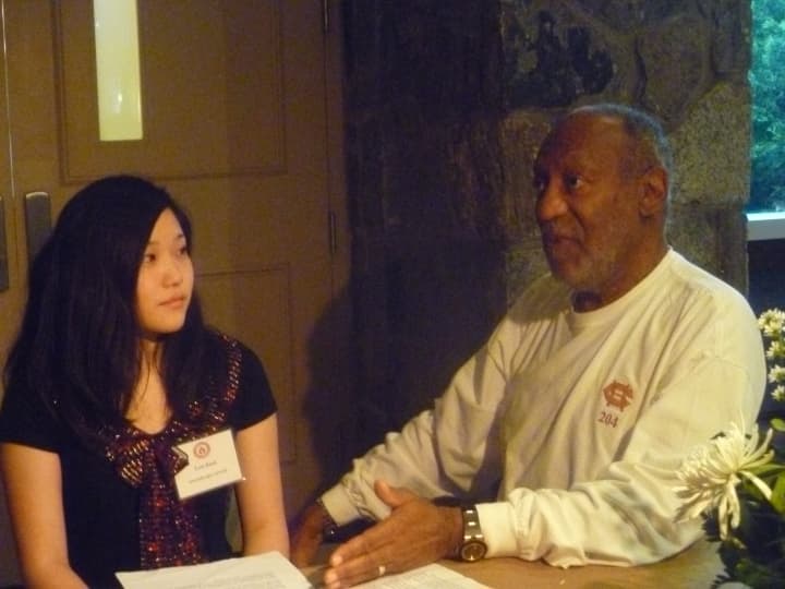 Cosby gives Eula Beck some advice before her speech.