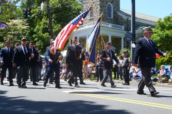 American military veterans march down Main Street during last year&#x27;s Memorial Day parade in Ridgefield. 