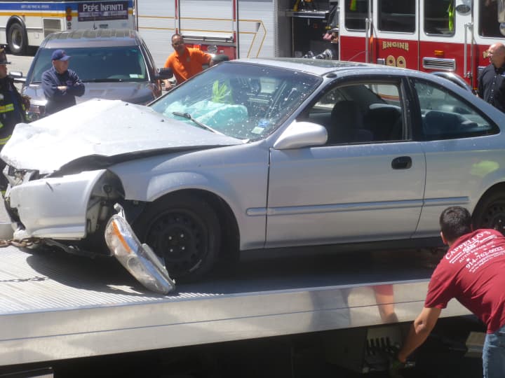 A vehicle involved in an accident on Route 9 in Ossining on Thursday, May 29, is towed away. 