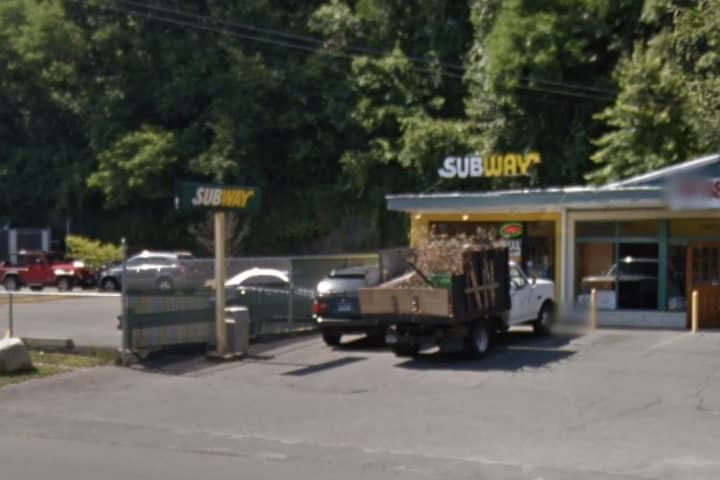 Police are searching for a suspect that robbed this Subway restaurant on Post Road East in Westport at gunpoint.