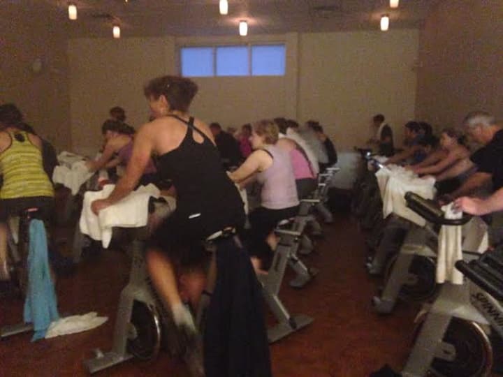 A 5:30 a.m. spin class of 40 members at Saw Mill Club has no problem with dedication. 