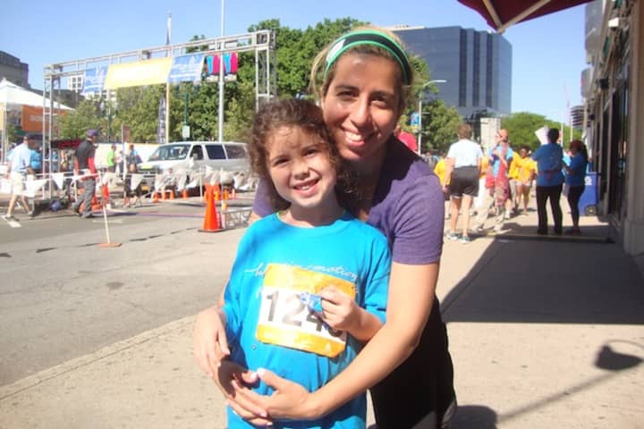 Hannah Evans and her mom Kami after finishing the 5k race Sunday in support of the Bennett Cancer Center at Stamford Hospital.