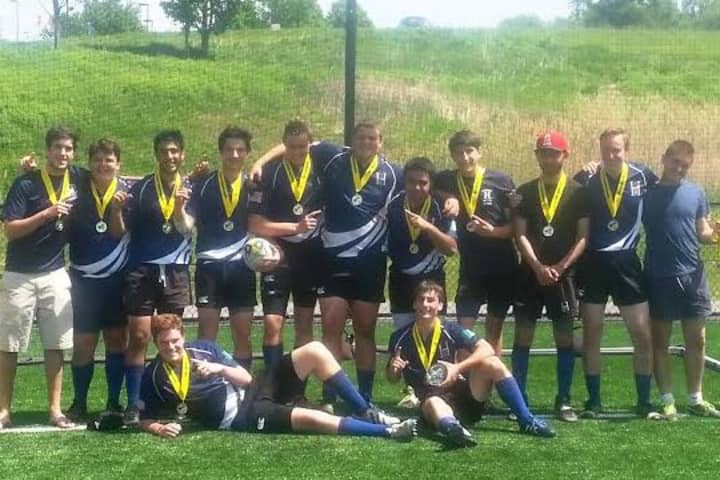 Seniors on Harvey&#x27;s rugby team celebrate after winning the state title.