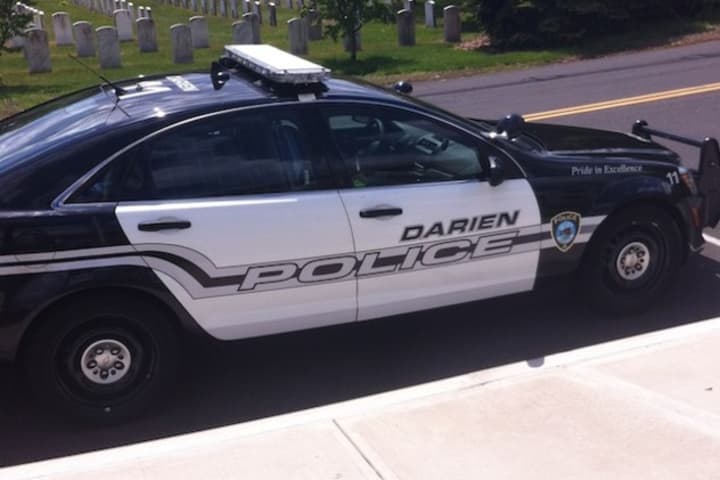Darien police charged Marc Devico with risk of injury to a minor and evading responsibility after neighbors said he ran over a sign with his truck.