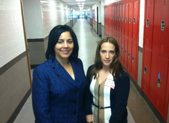 Nivea Torres, left, superintendent of the state&#x27;s technical school system, shows Kierstin Pupkowski, community affairs director for WTNH, the renovated J.M. Wright Technical High School during a tour for sponsors of the reopened school.