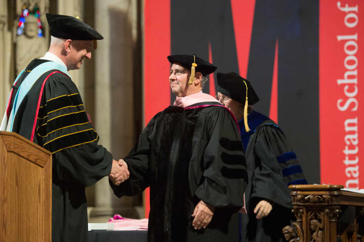 Peter Robbins, right, receives his honorary doctorate from Manhattan School of Music President James Gandre