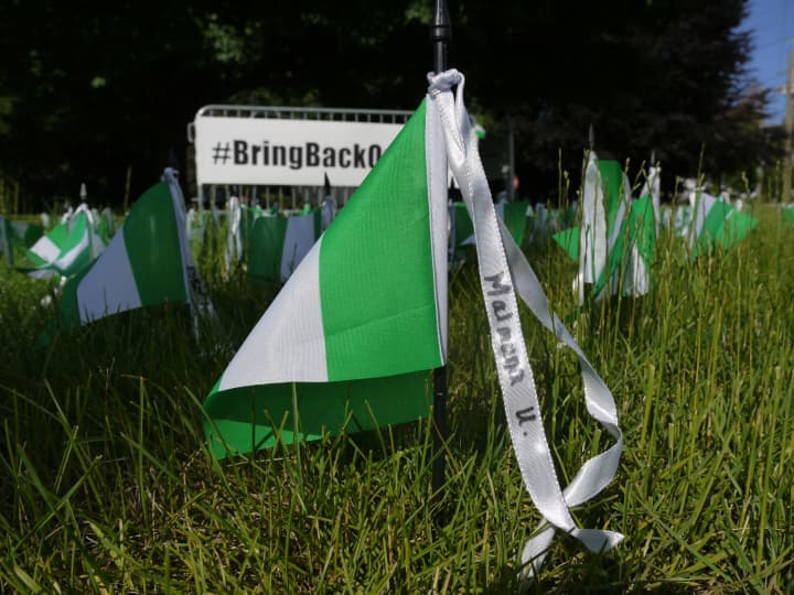 The Saugatuck Congregational Church in Westport hopes that its display of Nigerian flags with the names of the 300 missing girls will keep the topic on people&#x27;s mind.