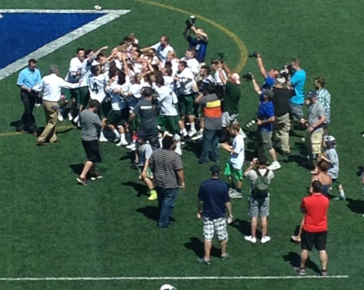 Yorktown players celebrate their seventh all-time state title.