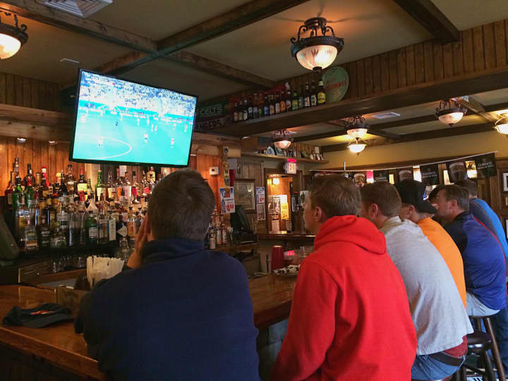 Recent Fairfield University graduates flock to Anna Liffey&#x27;s in Fairfield to watch the first match of the World Cup tournament from Brazil. 