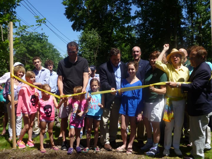 Andt Todd&#x27;s daughters cut the ribbon on the link between Lyndhurst and Gracemere Park. 