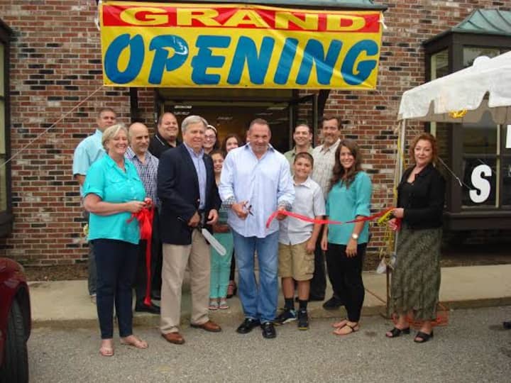 Westwood Flooring &amp; Design Center employees celebrate the business&#x27; grand opening in Wilton.
