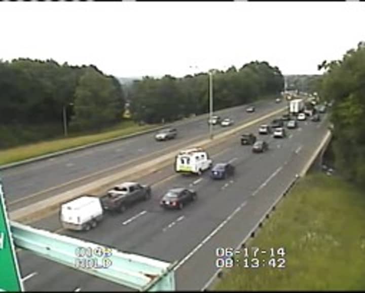 Traffic continues to flow on westbound I-84 in Danbury after a tractor-trailer spilled its load. 