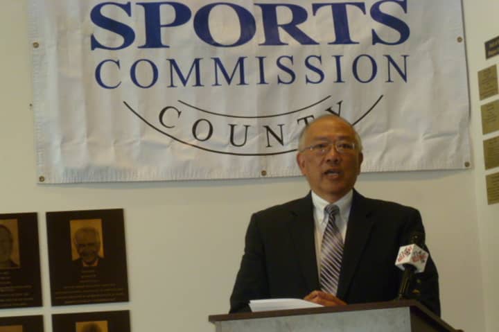 Wah Chu, the father of four-time Olympian Julie Chu, speaks at an announcement Tuesday in Stamford. Julie Chu was one of seven people selected for the Fairfield County Sports Hall of Fame.