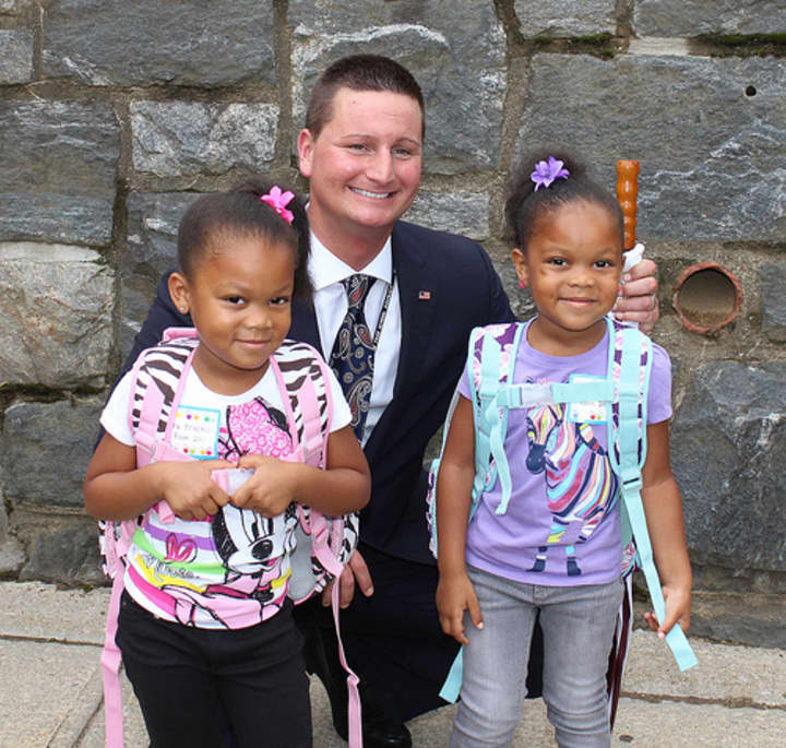 Elmsford Union Free School District Superintendent Joseph Ricca with two students on the opening day of school, September 2013.