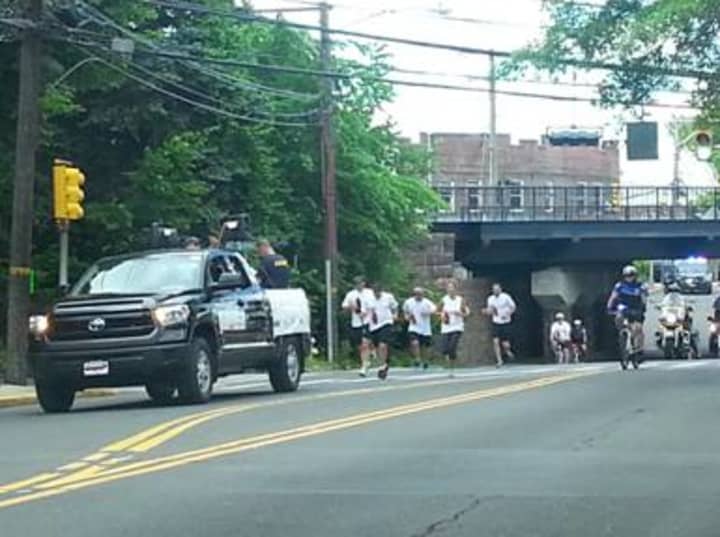 Officers with the Darien Police Department take part in the Law Enforcement Torch Run for Special Olympics Connecticut.