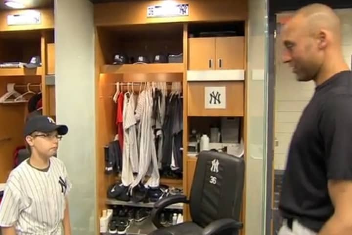 Wilton&#x27;s Ryan Tucker, left, meets Derek Jeter at Yankee Stadium. Tucker, 12, was adopted as an honorary member of the team along with two other children who are fighting brain tumors.