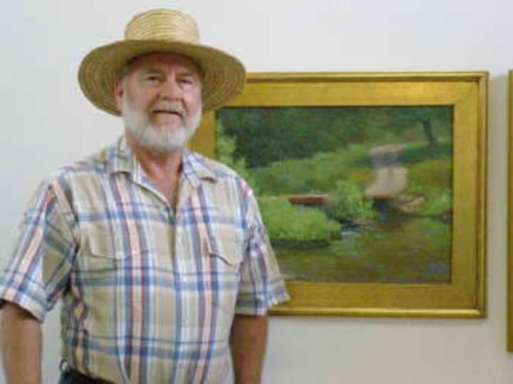 Jon Houglum, with his painting of the Cane River Bridge, will display his work in July at the Geary Gallery in Darien. 