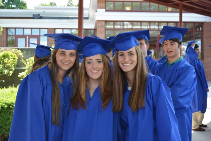 Three members of Horace Greeley High School&#x27;s Class of 2014 pose for a photo.