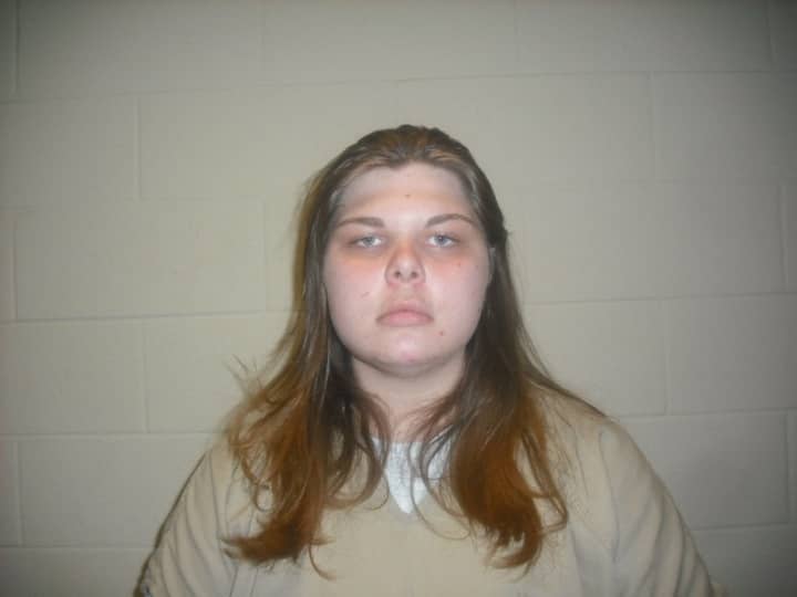 A Carmel woman has been charged with robbing a home in Southeast. 