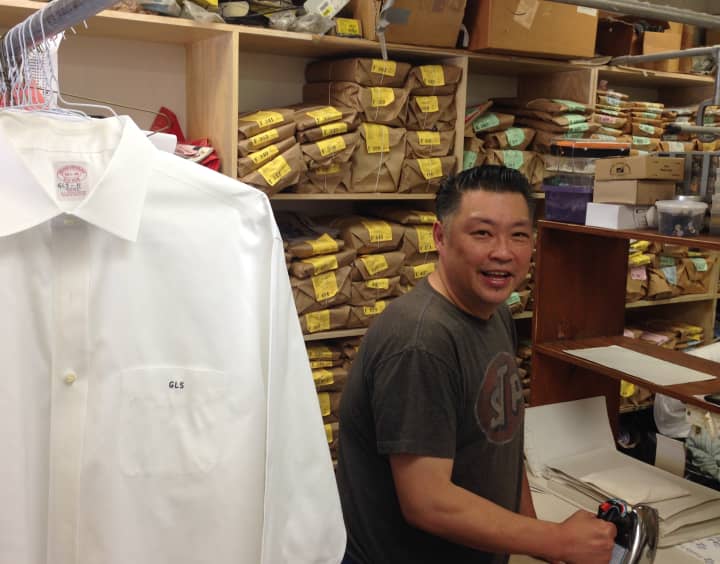 Eric Moy irons shirts on a beautiful weekday in downtown Rye. 