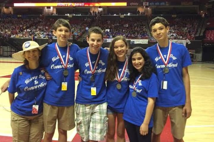 Isabella Altherr, Annabel Barry, Pierce Barry, Quinn Barry and Jaden Esse from Pequot Home School are pictured with Rebecca Taber-Conover, Connecticut state cooridantor for the event, after finishing second in a National History Day competition.
