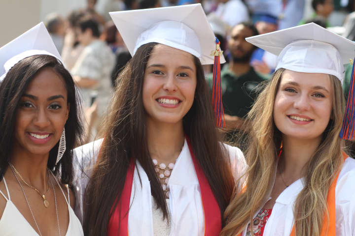Pamely Gomez, Kristella Morina and Jacqueline Firsty graduated from Yonkers Middle High School on June 25.