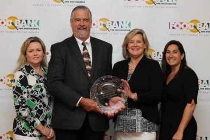 Brian Skanes, second from left with, Danae Richards, left,  Ellen Lynch and Samantha Johns, president, Junior League of Northern Westchester,