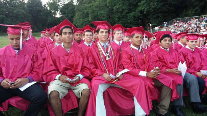 Students listen to the class leaders at Thursday&#x27;s graduation at Sleepy Hollow High School.