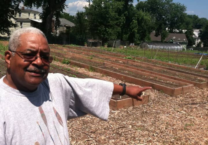 Fairgate Farm Manager Bill Callion points at raised garden beds at Fairgate Farm. Located at 129-143 Stillwater Ave., it is having a free public event called &quot;It Isn&#x27;t Easy Being Green,&quot; on Saturday from noon until 2 p.m.