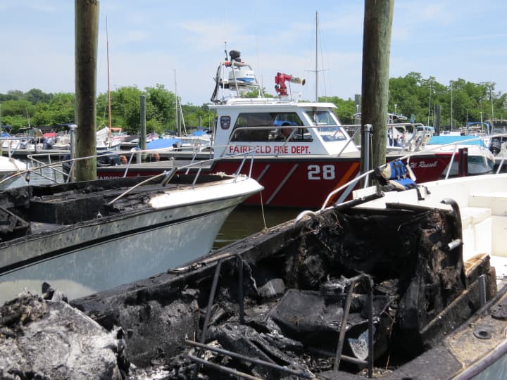 The Fairfield Fire Department&#x27;s boat responds to a blaze Sunday afternoon at the South Benson Marina complex. No injuries were reported. 