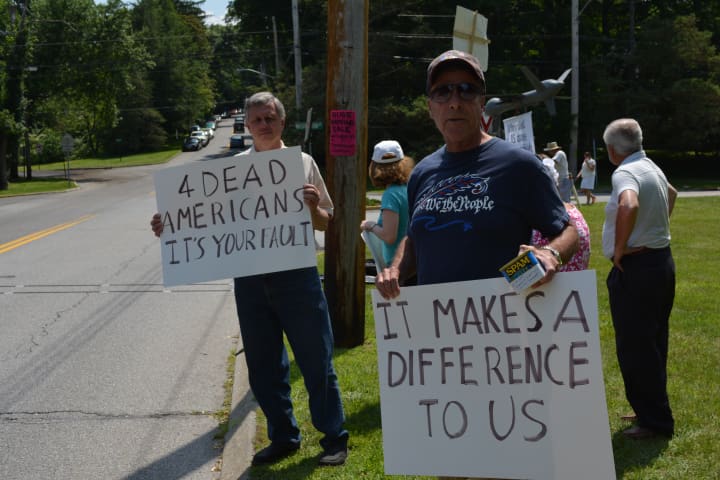 Protesters came to Chappaqua the day that Hillary Clinton held a book signing at the library.