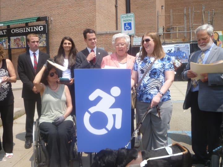 Assemblywoman Sandy Galef and state Sen. David Carlucci show off the new accessible signs in Ossining. 