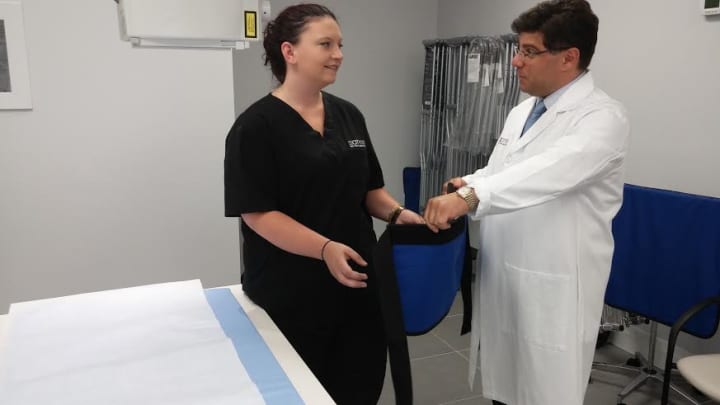 CityMD&#x27;s Dr. Frank Illuzzi works with a staffer in the x-ray room at the new Yonkers facility.