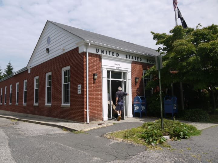 The distribution center at the Southport post office will remain open after residents cried out against a move to Bridgeport. 