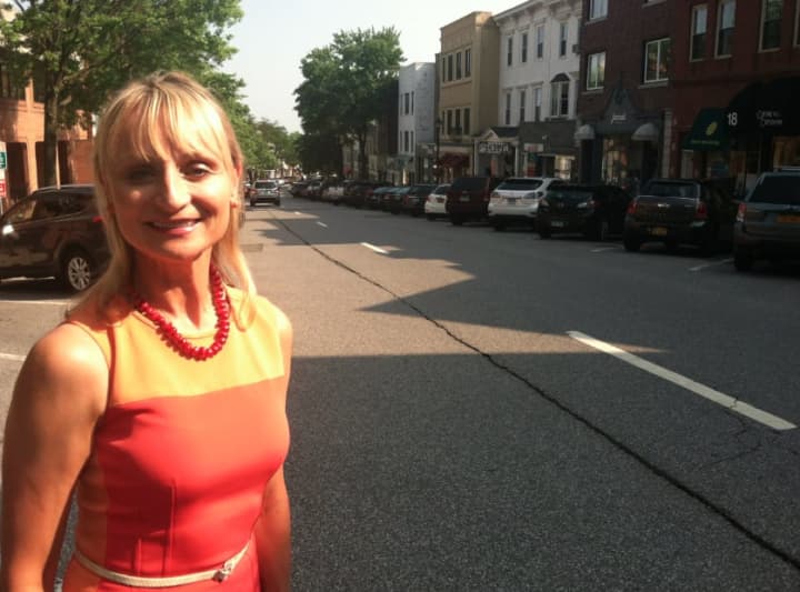 Greenwich Chamber of Commerce Executive Director Marcia O&#x27;Kane stands at the top of a quiet Greenwich Avenue on Tuesday afternoon. On Thursday, the Avenue will fill with shoppers as the four-day Sidewalk Sales begin.