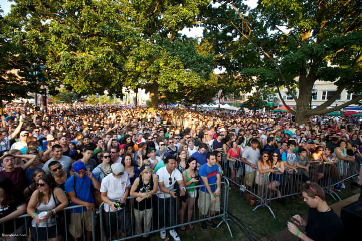 Crowds of young adults gather at Columbus Park for an Alive@Five concert in downtown Stamford. Events like this outdoor concert puts Stamford among the most exciting places in the state. 